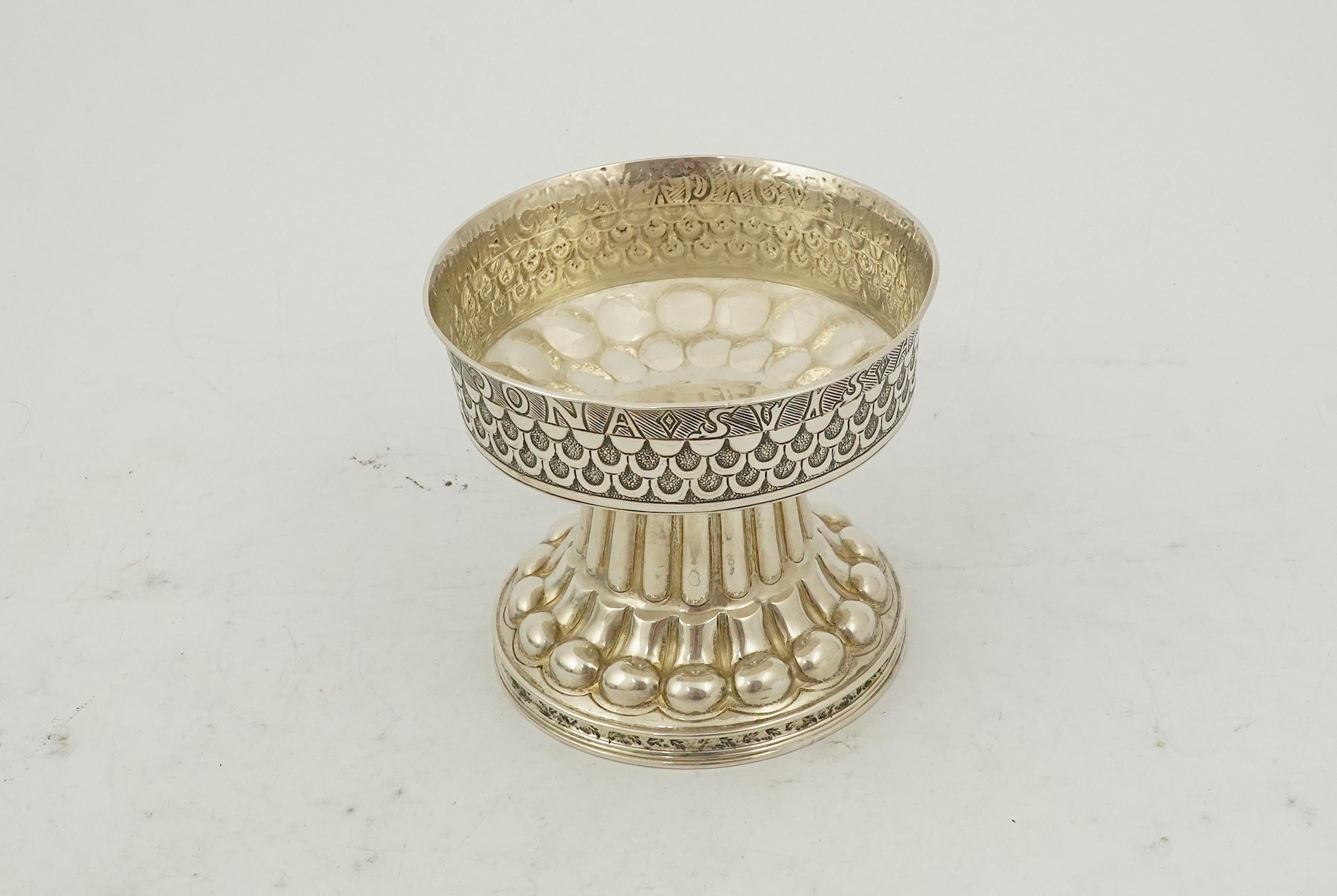 An Edwardian embossed silver replica model of the 16th century Tudor Cup or Holms Cup, by Nathan & Hayes